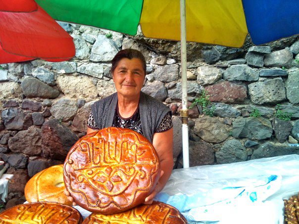 Old lady in Geghard Monastery (photo by author)